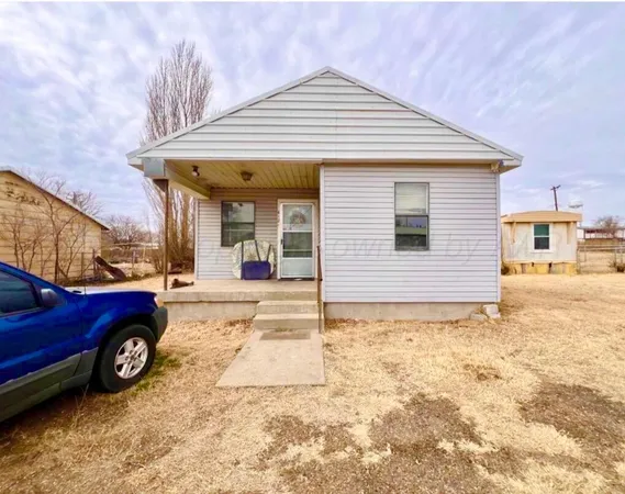 a view of a car in front of a house