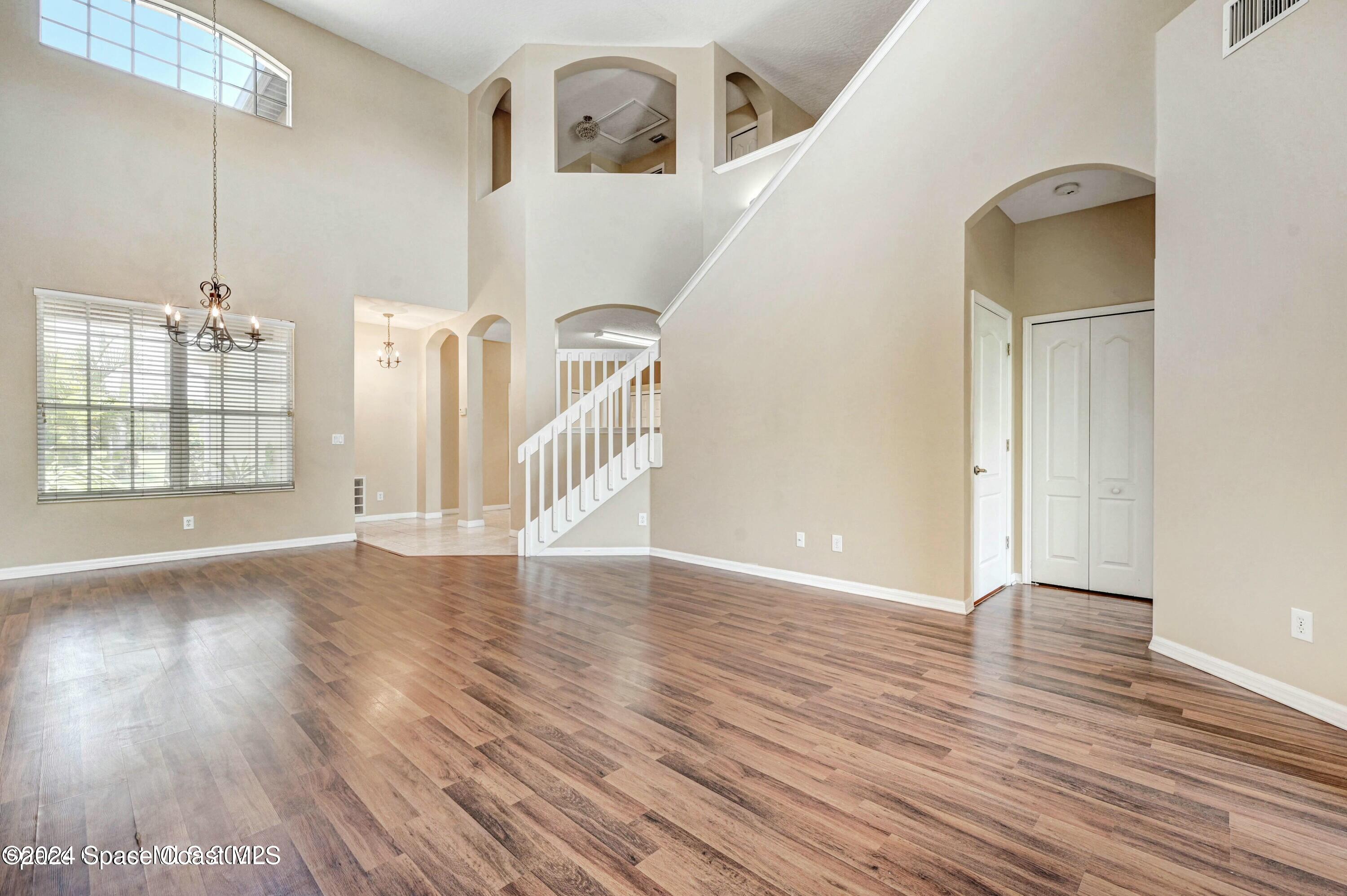 244 Intrepid Way Indialantic, FL 32903 - Photo 11 of 42 a view of empty room with wooden floor