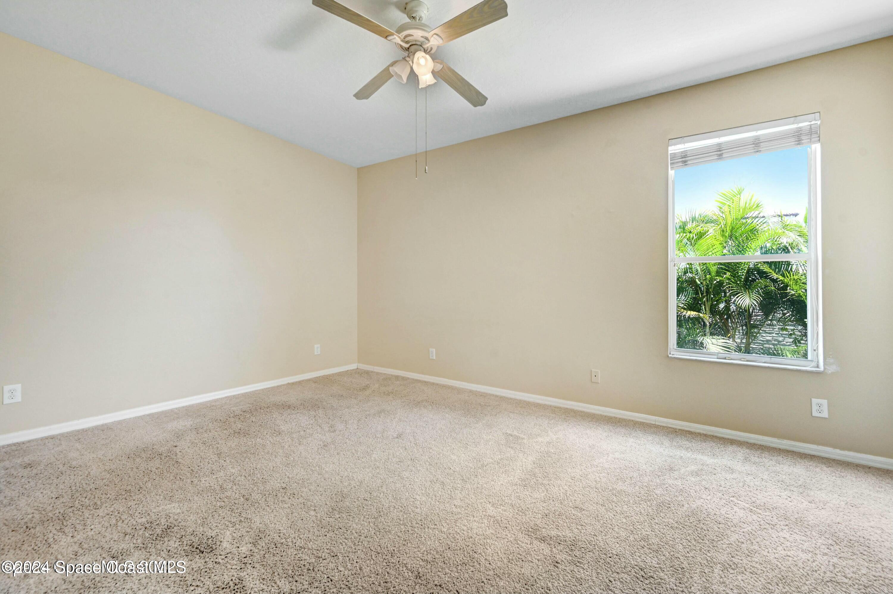 244 Intrepid Way Indialantic, FL 32903 - Photo 17 of 42 an empty room with a window