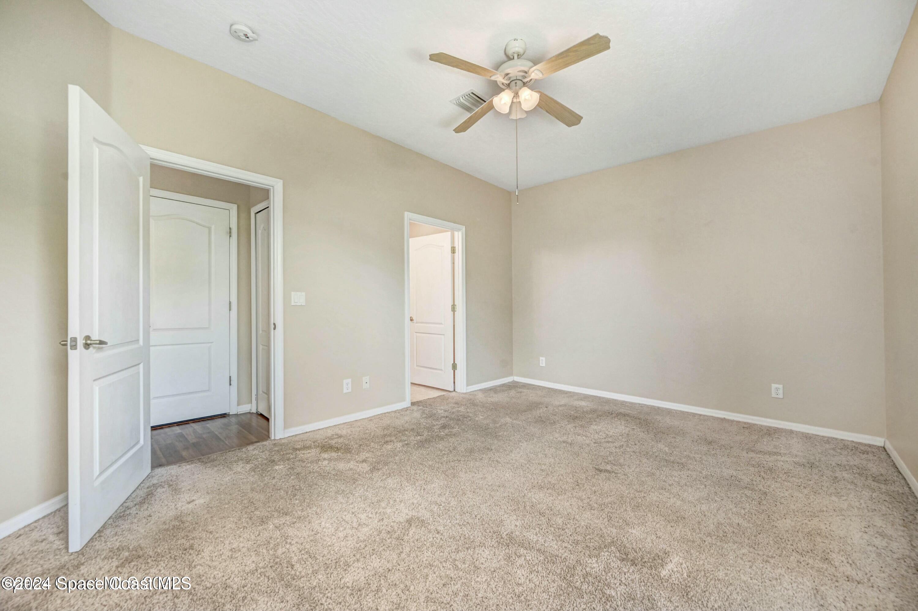 244 Intrepid Way Indialantic, FL 32903 - Photo 18 of 42 an empty room with a bathroom