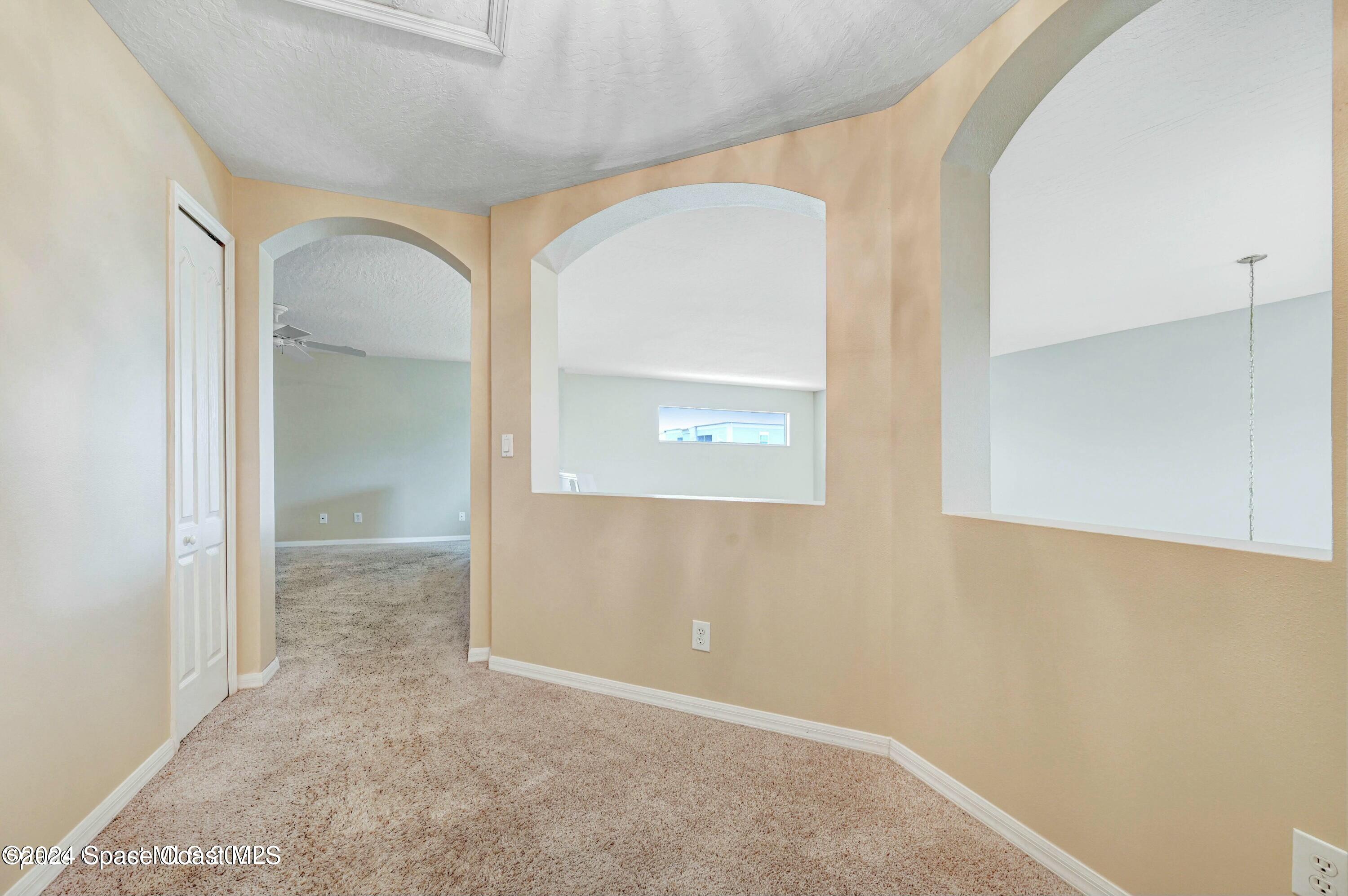 244 Intrepid Way Indialantic, FL 32903 - Photo 27 of 42 an empty room with mirror and a sink