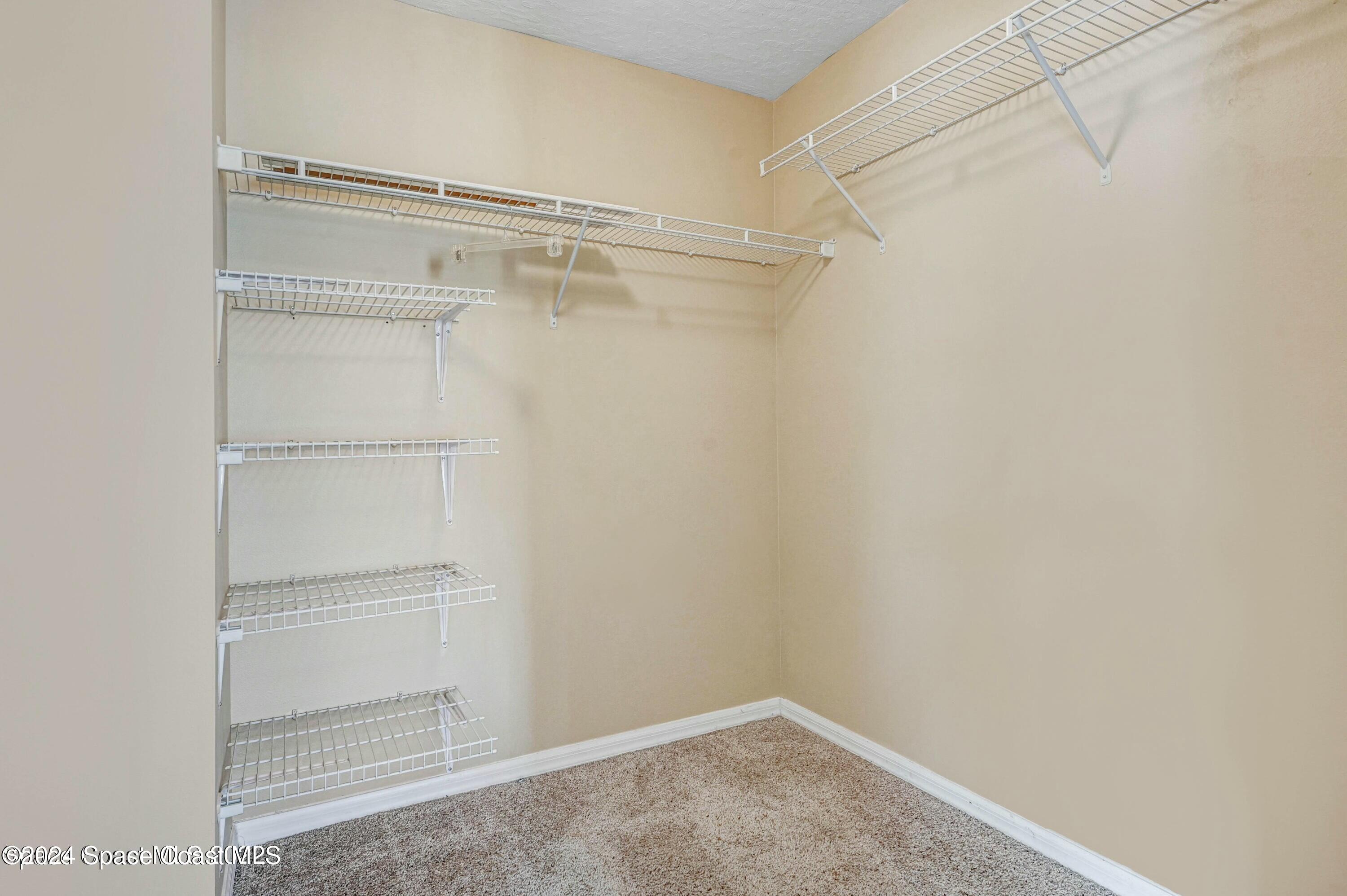 244 Intrepid Way Indialantic, FL 32903 - Photo 31 of 42 a view of an empty walk in closet