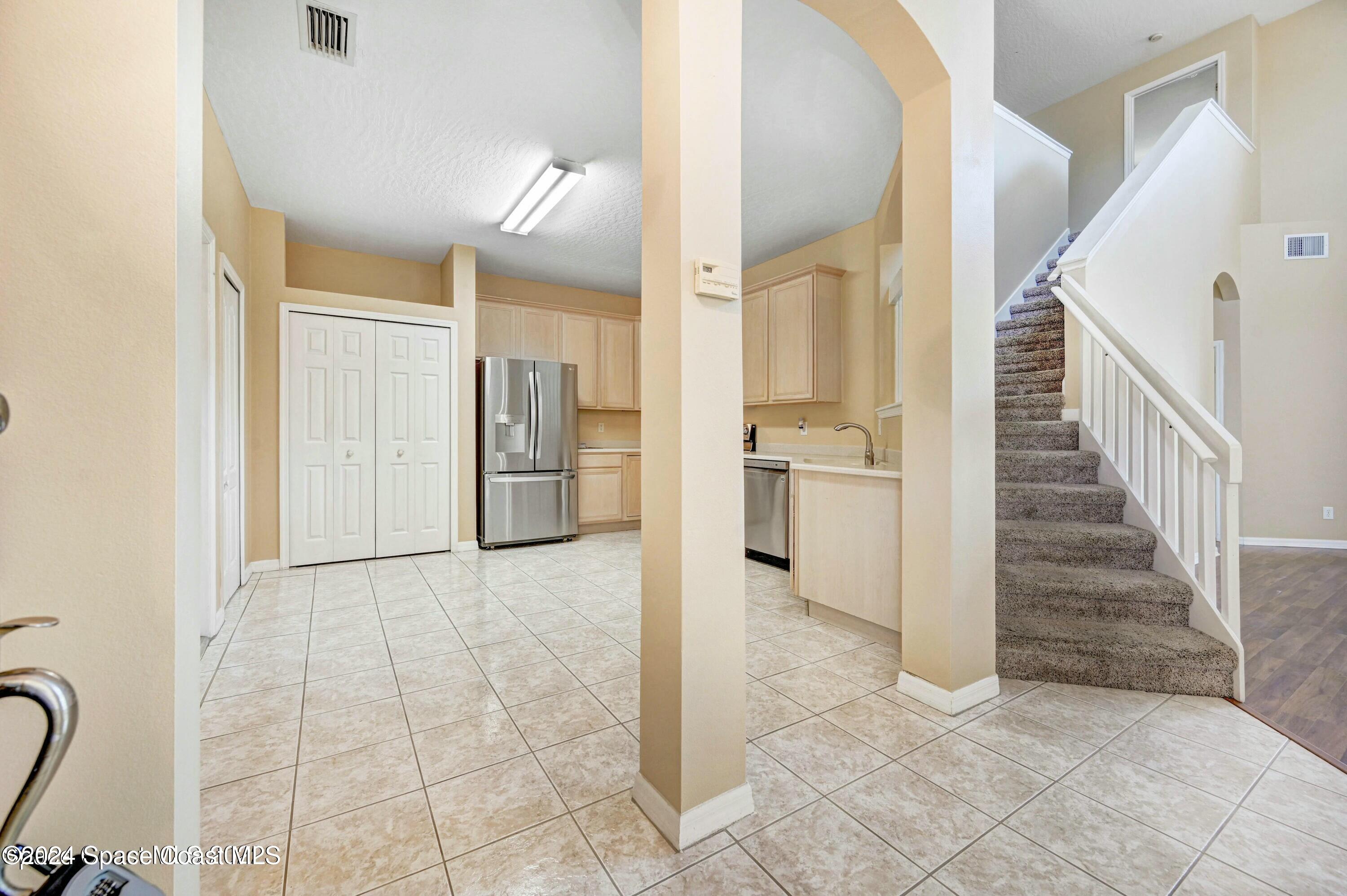244 Intrepid Way Indialantic, FL 32903 - Photo 5 of 42 a view of a hallway with a furniture