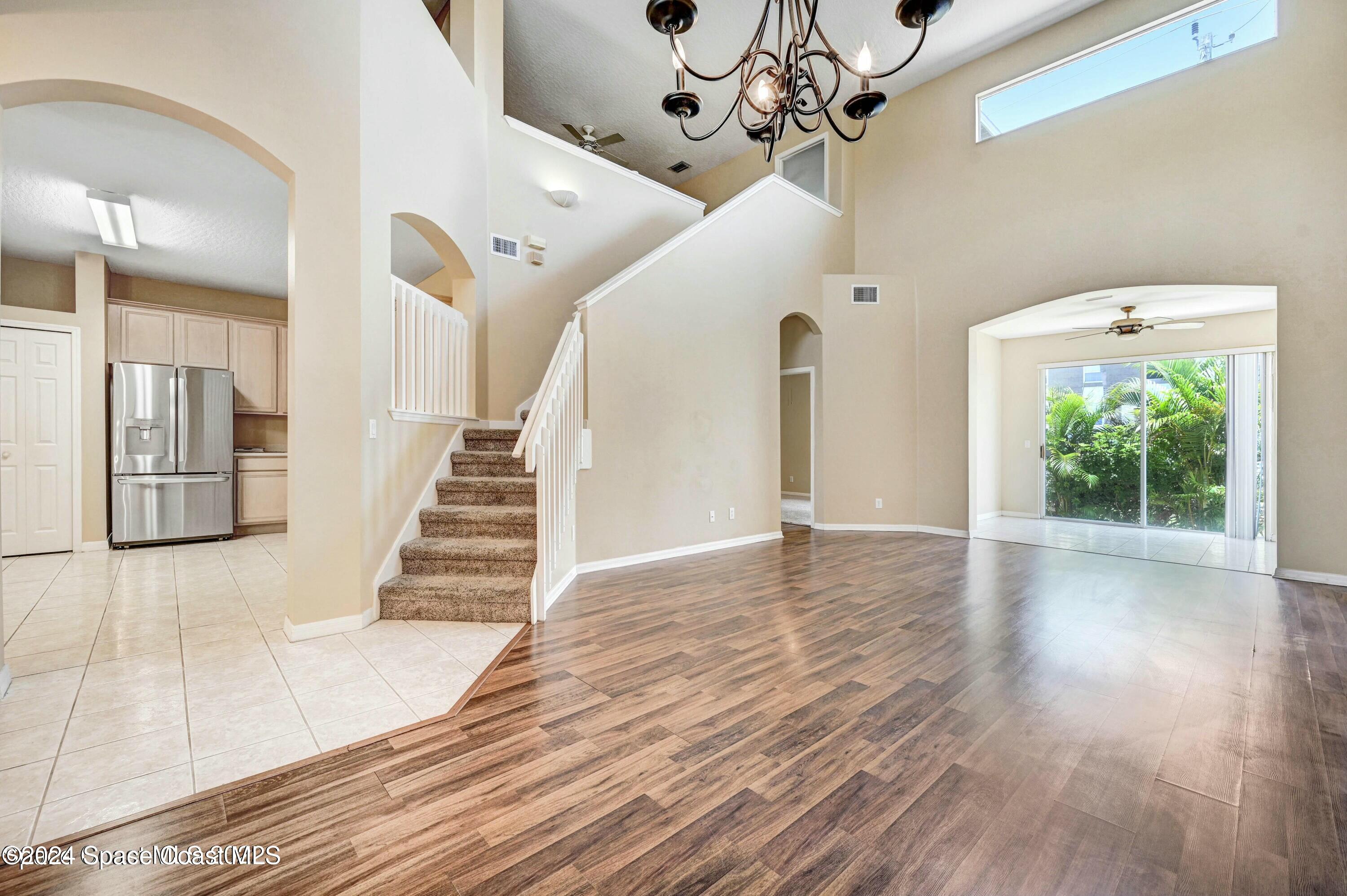 244 Intrepid Way Indialantic, FL 32903 - Photo 10 of 42 a view of entryway and hall with wooden floor