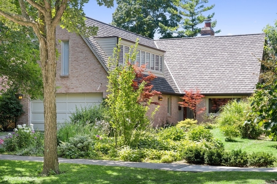 a view of a house with garden and plants