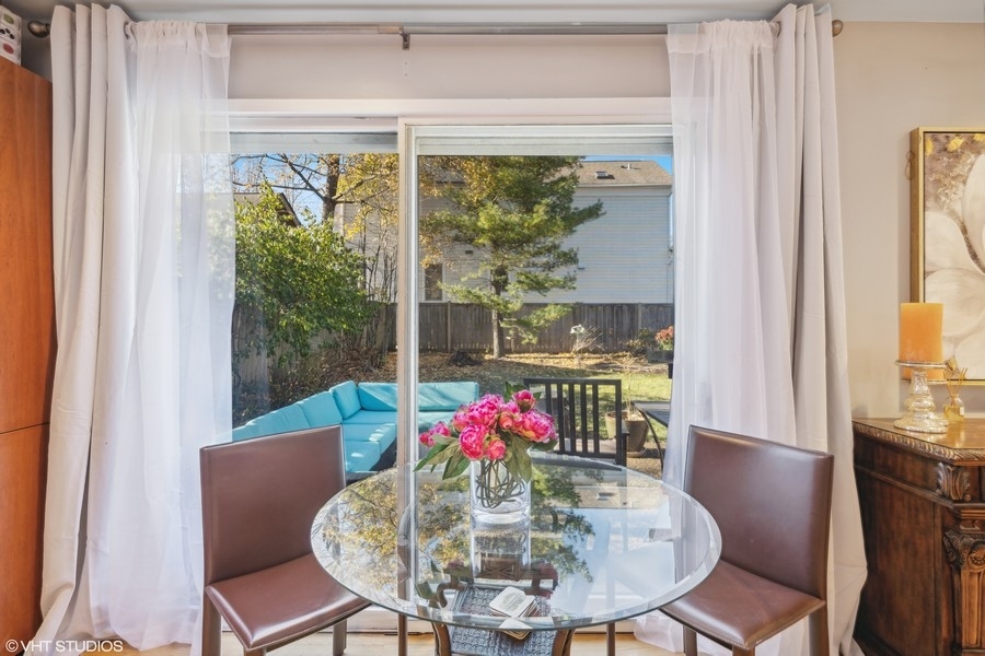 290 Poplar Street Winnetka, IL 60093 - Photo 18 of 55 a view of a dining room with furniture window and outside view