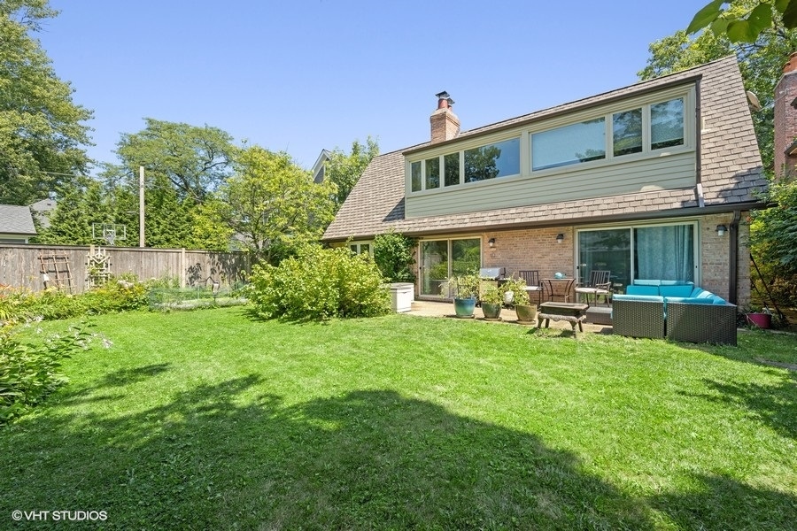 290 Poplar Street Winnetka, IL 60093 - Photo 20 of 55 a view of a house with a yard porch and sitting area