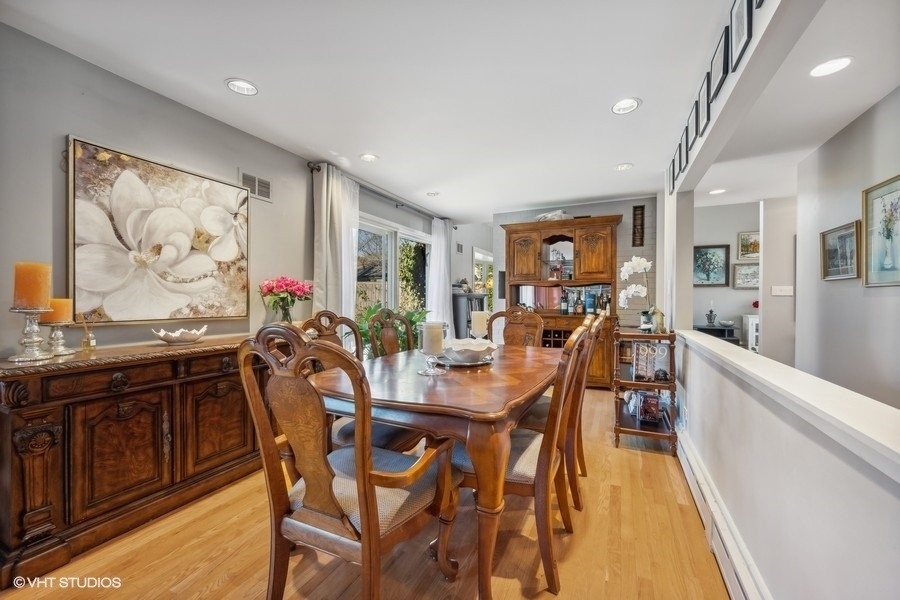 290 Poplar Street Winnetka, IL 60093 - Photo 23 of 55 a view of a dining room with furniture window and wooden floor