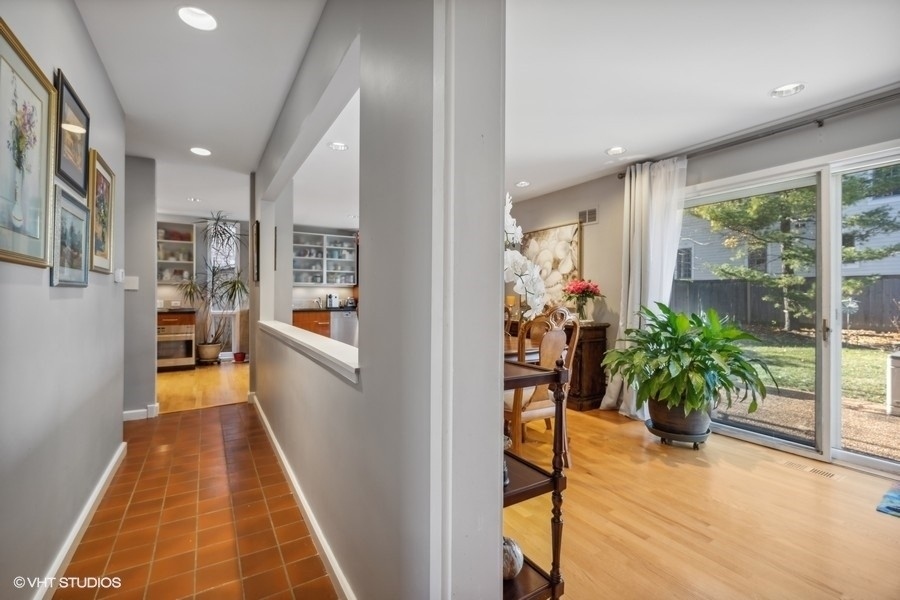 290 Poplar Street Winnetka, IL 60093 - Photo 24 of 55 a view of a hallway with wooden floor and a potted plant