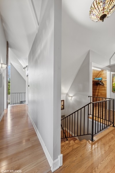 290 Poplar Street Winnetka, IL 60093 - Photo 25 of 55 a view of a hallway with wooden floor