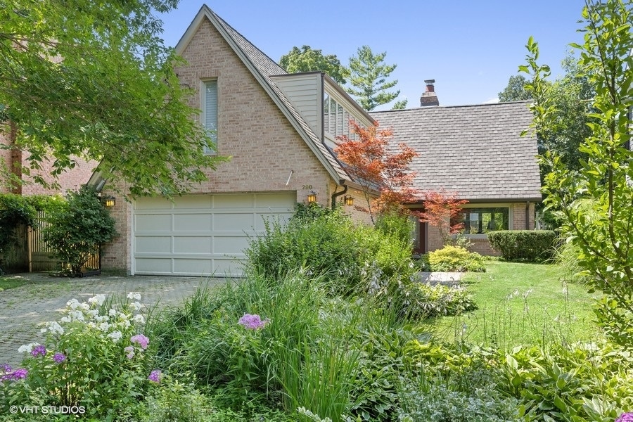 290 Poplar Street Winnetka, IL 60093 - Photo 3 of 55 a view of a house with a yard and garden
