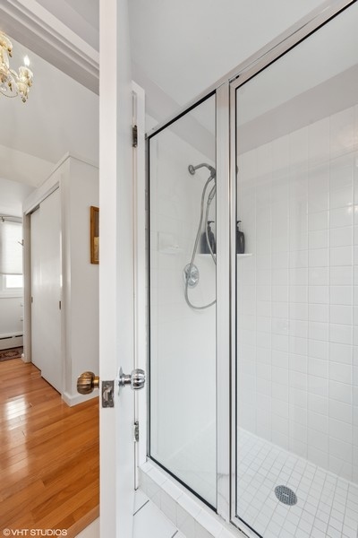 290 Poplar Street Winnetka, IL 60093 - Photo 31 of 55 a bathroom with a glass shower door and a glass door