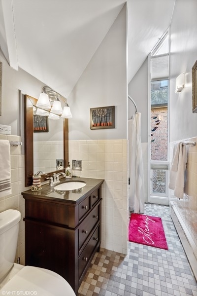 290 Poplar Street Winnetka, IL 60093 - Photo 39 of 55 a bathroom with a sink vanity mirror and toilet