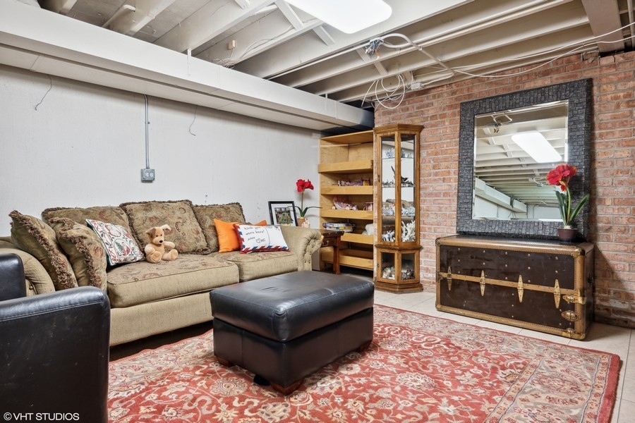 290 Poplar Street Winnetka, IL 60093 - Photo 43 of 55 a living room with furniture a rug and a window
