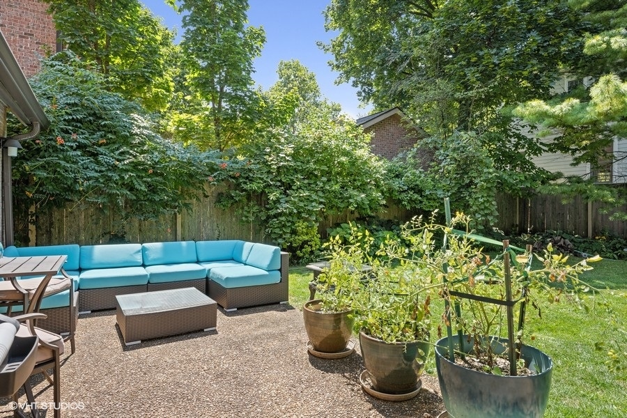 290 Poplar Street Winnetka, IL 60093 - Photo 49 of 55 a view of a backyard with plants and a fountain