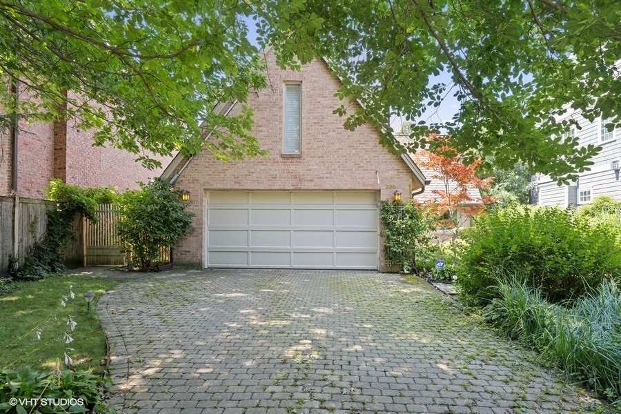 290 Poplar Street Winnetka, IL 60093 - Photo 50 of 55 a front view of a house with a garage