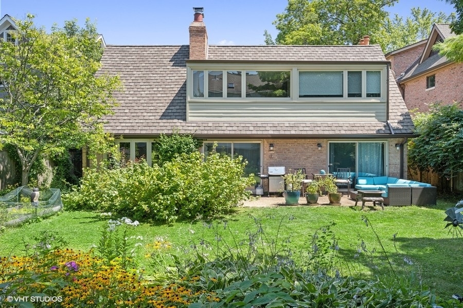 290 Poplar Street Winnetka, IL 60093 - Photo 51 of 55 a front view of house with a garden and patio