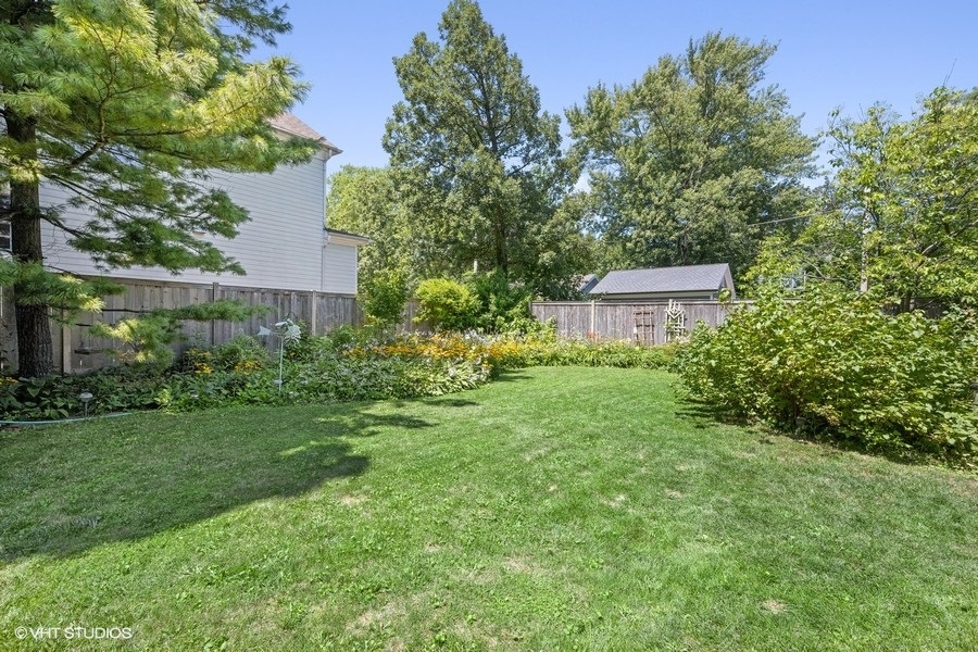 290 Poplar Street Winnetka, IL 60093 - Photo 52 of 55 a view of a house with a backyard