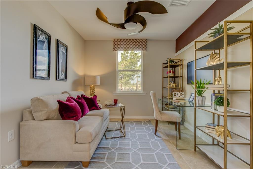 14533 Edgewater Circle Naples, FL 34114 - Photo 1 of 24 a living room with furniture and a window