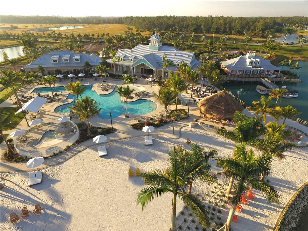 14533 Edgewater Circle Naples, FL 34114 - Photo 4 of 24 a view of a lake with houses