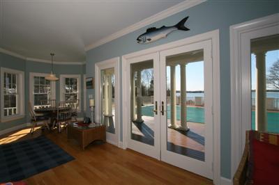 15 Elgin Road Pocasset, MA 02559 - Photo 11 of 29 a living room with furniture floor to ceiling window and wooden floor
