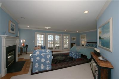 15 Elgin Road Pocasset, MA 02559 - Photo 18 of 29 a living room with furniture fireplace and flat screen tv