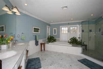 15 Elgin Road Pocasset, MA 02559 - Photo 20 of 29 a living room with furniture and a chandelier