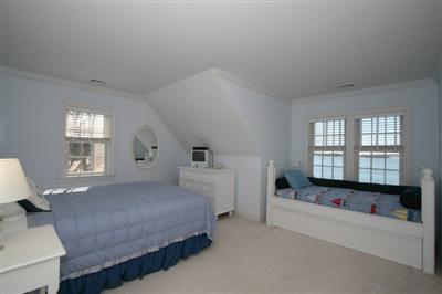 15 Elgin Road Pocasset, MA 02559 - Photo 23 of 29 a spacious bedroom with a bed and a window