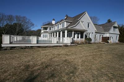 15 Elgin Road Pocasset, MA 02559 - Photo 4 of 29 a front view of a house with a garden