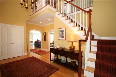 15 Elgin Road Pocasset, MA 02559 - Photo 7 of 29 a living room with couches and a dining table with wooden floor