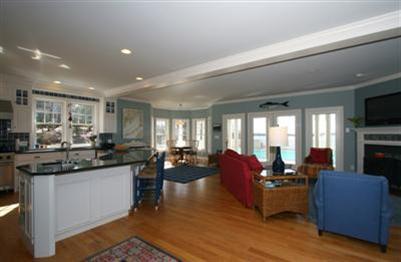 15 Elgin Road Pocasset, MA 02559 - Photo 8 of 29 a living room with furniture kitchen view and a large window