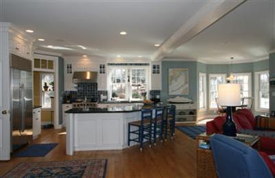15 Elgin Road Pocasset, MA 02559 - Photo 9 of 29 a living room with stainless steel appliances kitchen island granite countertop furniture and a wooden floor