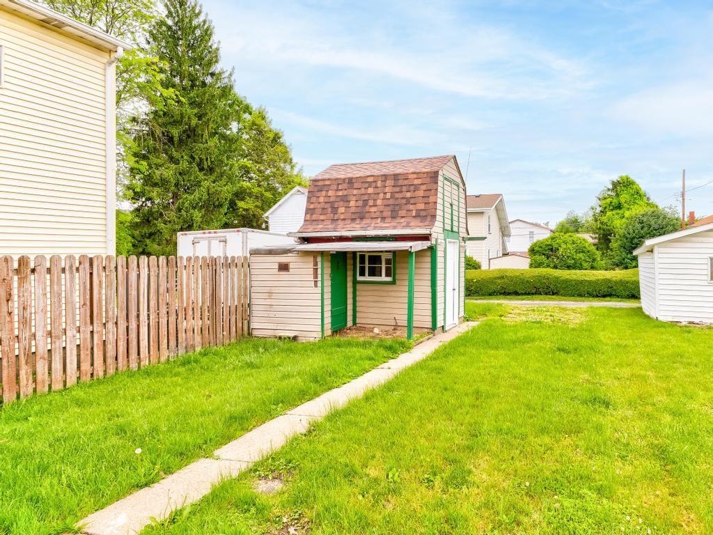 448 Park Street Rochester, PA 15074 - Photo 28 of 29 a view of an house with backyard space and garden