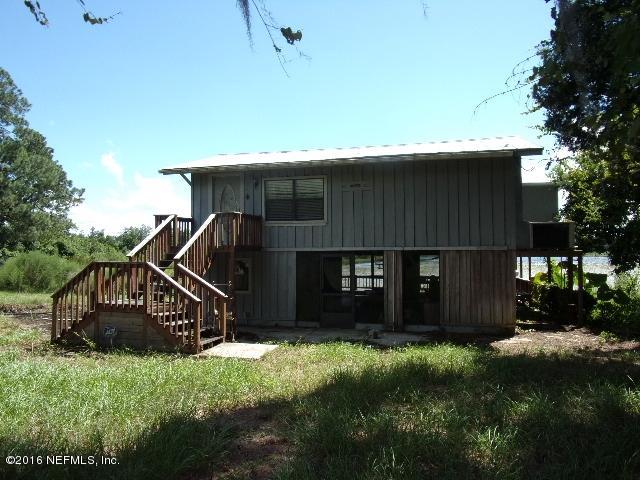 275 Huntington Shortcut Road Crescent City, FL 32112 - Photo 1 of 24 a view of house with yard and green space