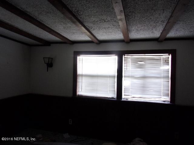 275 Huntington Shortcut Road Crescent City, FL 32112 - Photo 20 of 24 a view of an empty room with a window