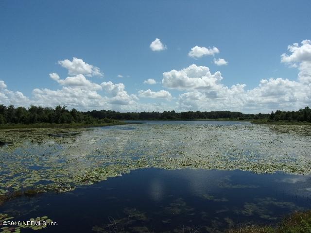 275 Huntington Shortcut Road Crescent City, FL 32112 - Photo 22 of 24 a view of a lake in between of the house