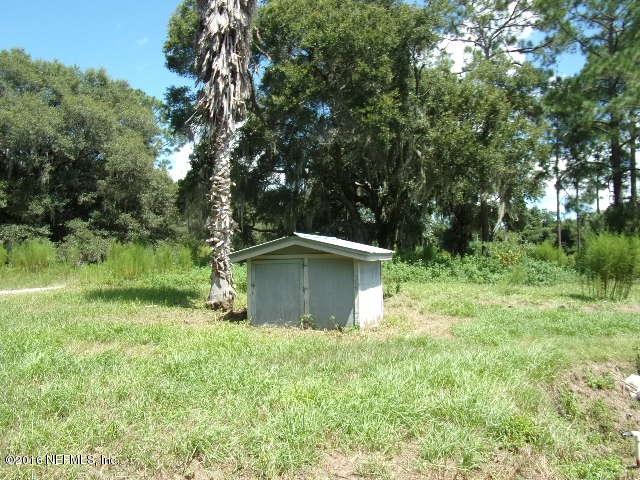 275 Huntington Shortcut Road Crescent City, FL 32112 - Photo 23 of 24 a backyard of a house with lots of green space