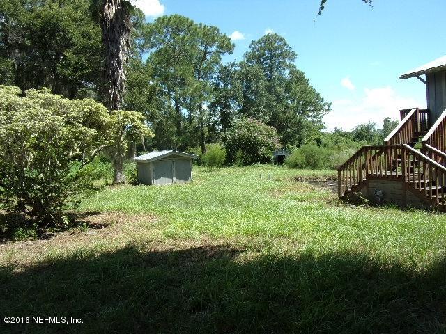 275 Huntington Shortcut Road Crescent City, FL 32112 - Photo 24 of 24 a backyard of a house with lots of green space