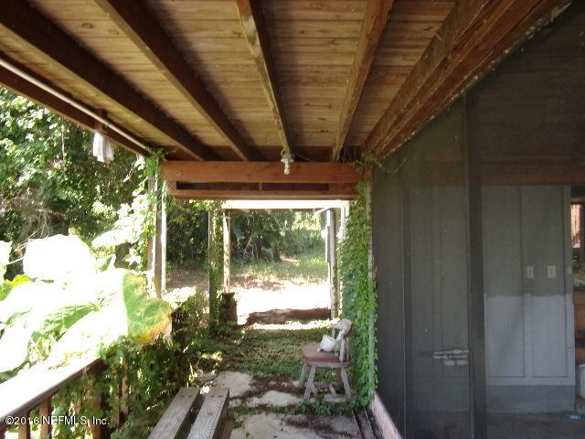 275 Huntington Shortcut Road Crescent City, FL 32112 - Photo 9 of 24 a view of porch with a garden