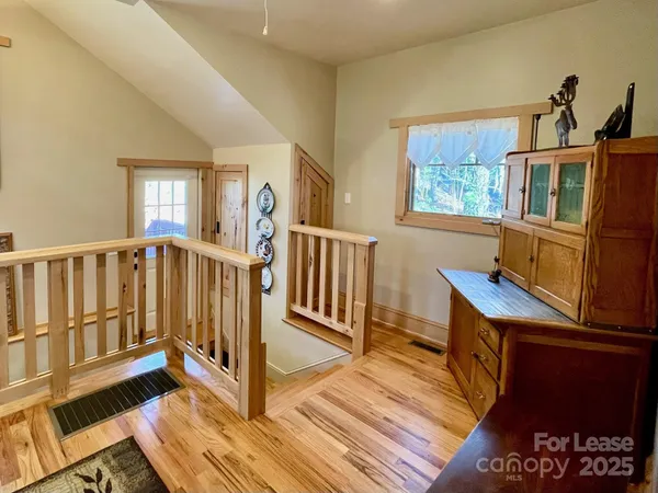 a kitchen with stainless steel appliances kitchen island granite countertop a refrigerator dining table and chairs