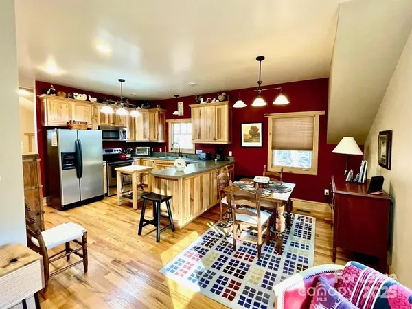 a room with lots of chairs and mirrors