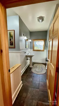 a view of a swimming pool with a patio and a tub