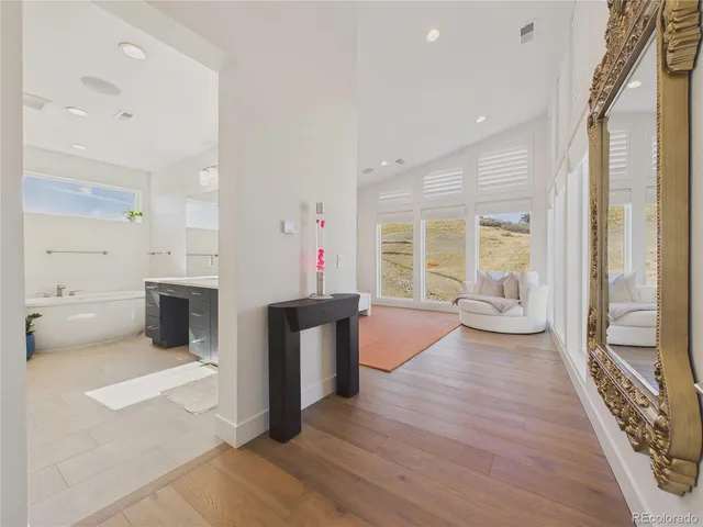a view of a living room and kitchen with a large window