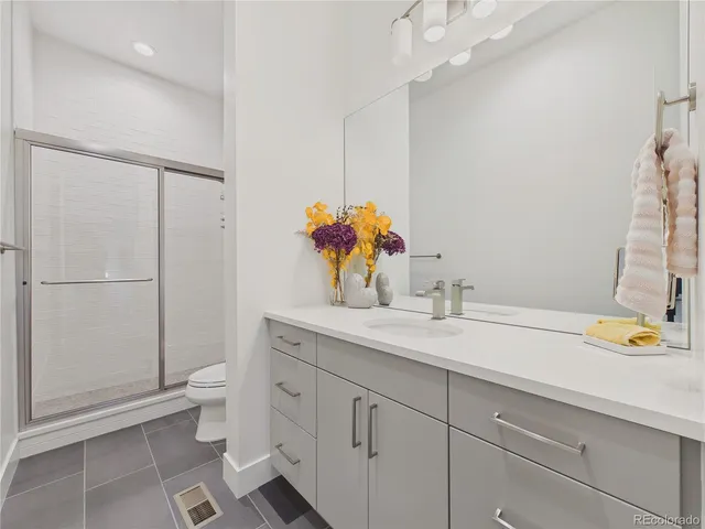 a view of a workspace with furniture and a potted plant