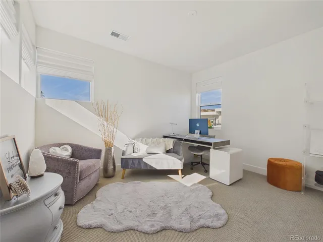 a workspace with furniture and bathroom