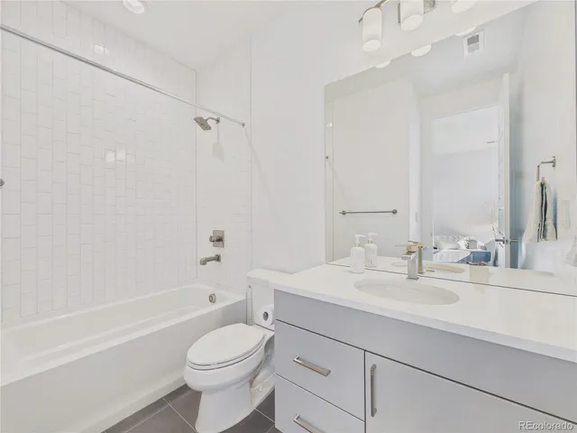 a bed room with a bed and a couch