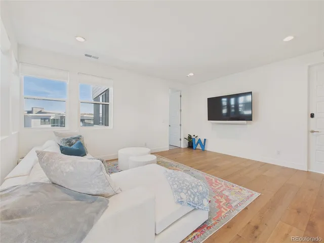 a utility room with cabinets washer and dryer