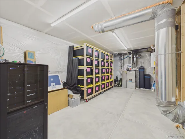 a bedroom with furniture and a large window