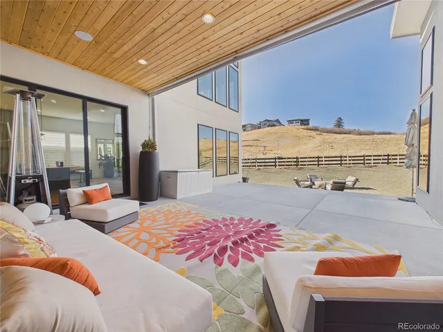a view of a brick house with many windows and a yard