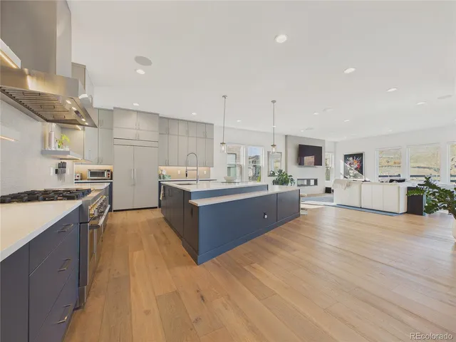 a large kitchen with stainless steel appliances and a lots of counter space
